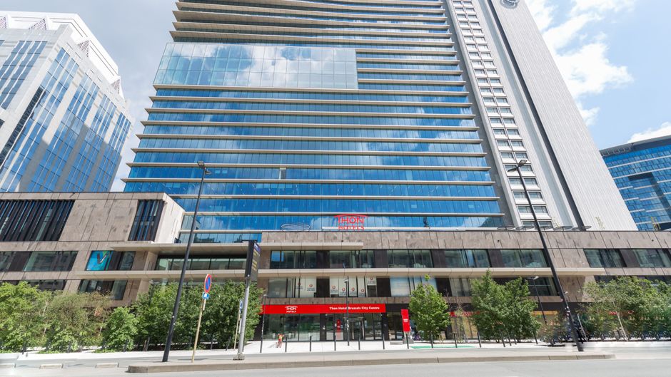Modern Thon Hotel Brussels: sleek glass facade for corporate meetings and events.