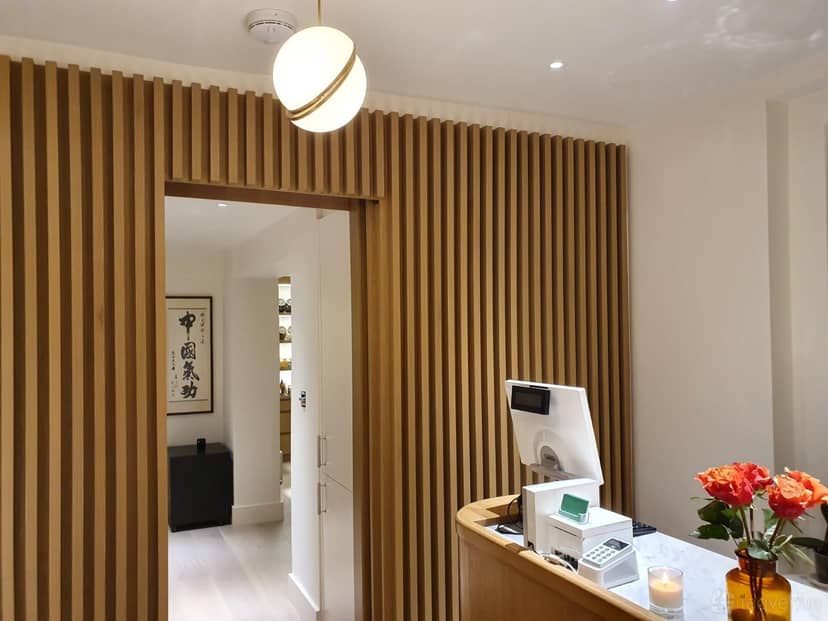 Main Training Hall, inviting wooden reception area, perfect for professional meetings.