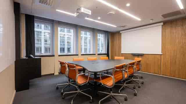 Boardroom-style meeting room at Lindesnes Nationaltheatret for corporate events and workshops.