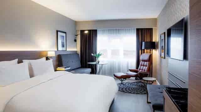 Modern meeting room at Radisson Blu Plaza Hotel Oslo with ergonomic workspace for business events.