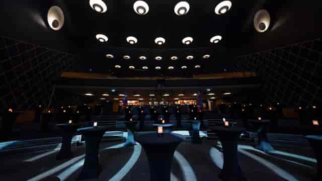 Rockefeller concert hall transformed into a sophisticated networking lounge for event receptions.