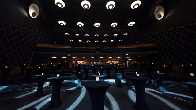 Rockefeller concert hall transformed into a sophisticated networking lounge for event receptions.