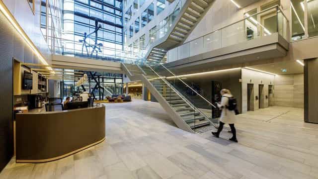Modern atrium at Skøyen Atrium for corporate networking reception and event registration.