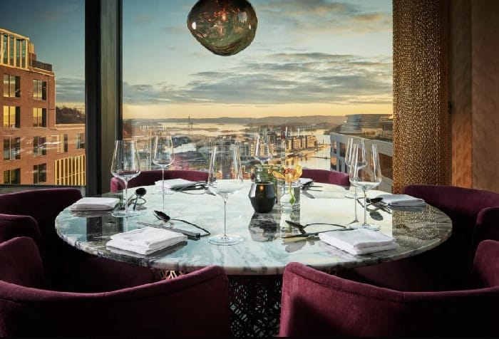 Private dining room at Nodee Sky with marble table for executive dinners and VIP events.