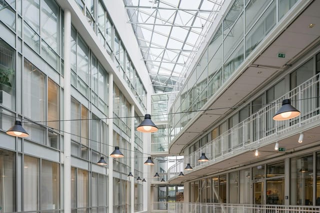 Light-filled atrium at Forskningsparken, ideal for corporate networking events and vendor showcases.