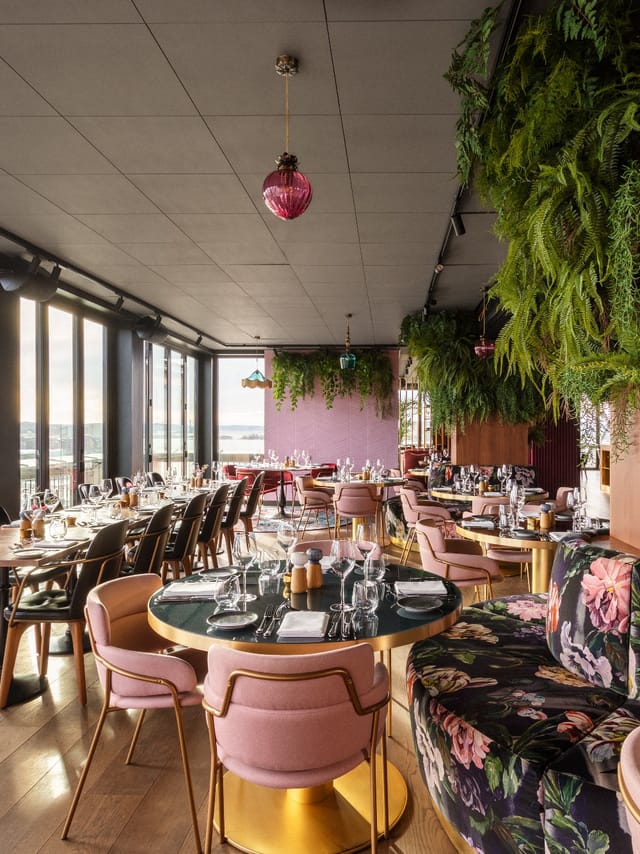 Upscale Clarion Hotel Oslo restaurant with biophilic design for networking events and dinners.