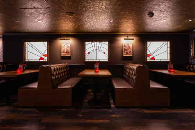 Cozy dining area at The Garrison, Peaky Blinders Manchester, ideal for intimate gatherings.