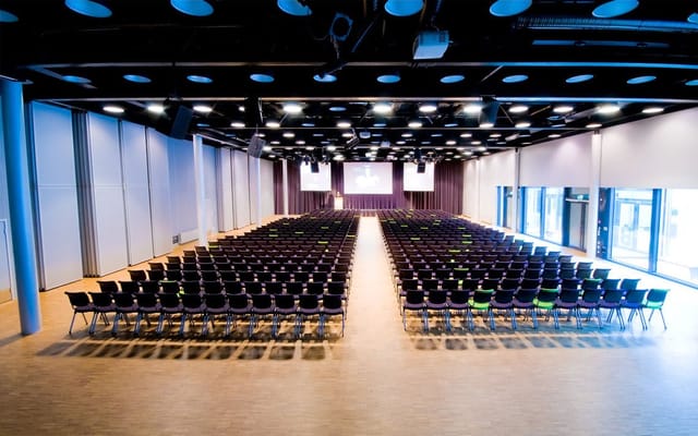 Theater-style plenary hall at Meet Ullevaal convention center for corporate conferences and events.