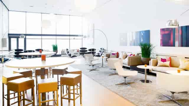 NOVA Spektrum Hall E: Modern breakout space with lounge seating for corporate networking events.