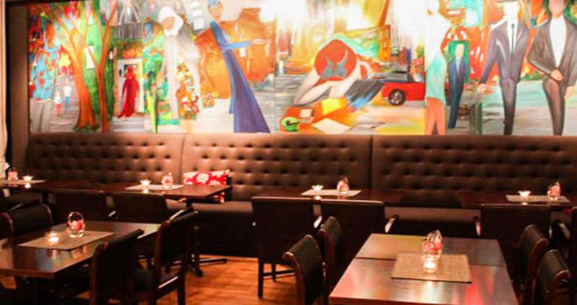 Brasserie at Hotel Gabelshus with mural, ideal for networking and sophisticated corporate events.