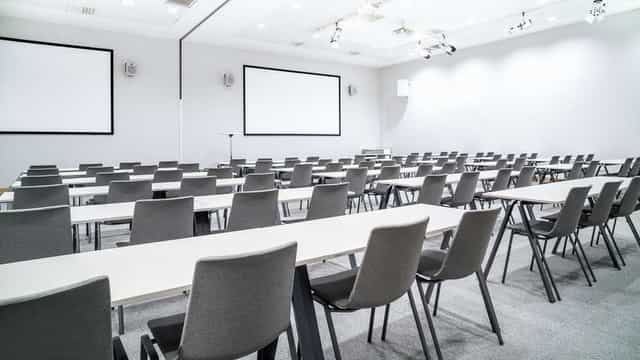 Classroom-style meeting room at Radisson Oslo Airport for corporate workshops and training.