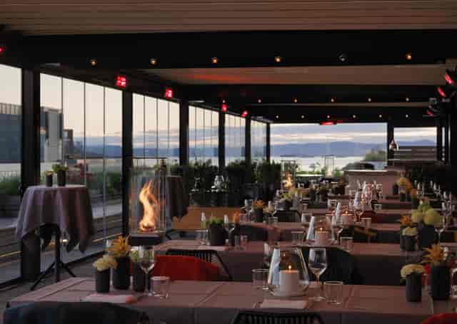 Thief Roof Bar & Grill: Rooftop venue with fire feature for corporate events and evening receptions.