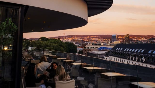 TAK Oslo rooftop venue with sunset skyline views for corporate networking and premium events.