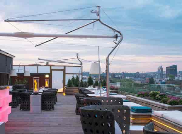 Rooftop terrace with outdoor bar and lounge, perfect for corporate cocktail and networking events.