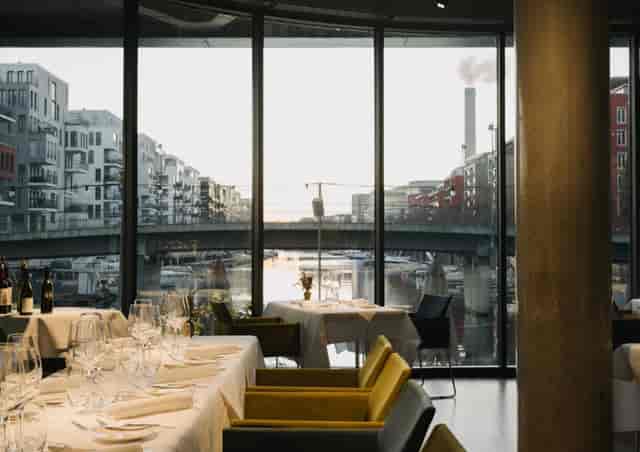 Modern venue with city views, ideal for corporate dinners and networking luncheons.
