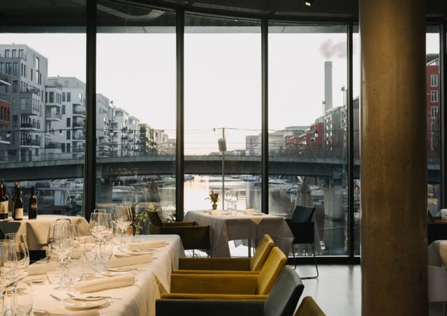 Modern venue with city views, ideal for corporate dinners and networking luncheons.