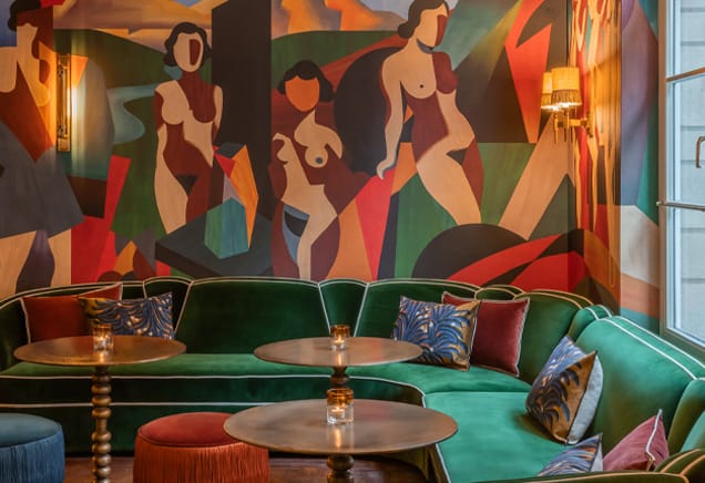Bar Magritte at Hotel Amigo with artistic mural for intimate breakout sessions and cocktails.