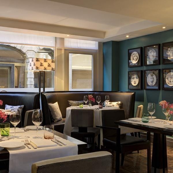 Upscale Hotel Amigo suite for corporate dinners and professional client meetings.