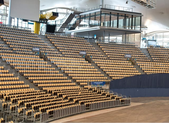 Olympiahalle tiered plenary venue with VIP suites for large-scale conferences and keynote sessions.