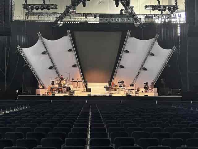 Olympiahalle conference stage with tiered platforms for corporate plenary and keynote events.