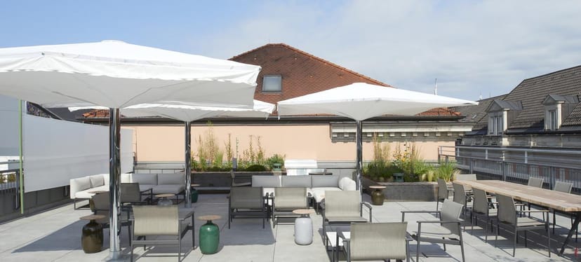 Modern rooftop garden with lounge seating for networking receptions and cocktail events.