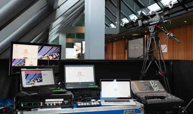 Indoor production command center with AV equipment for hybrid and broadcast events.