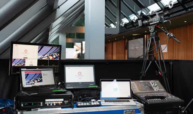 Indoor production command center with AV equipment for hybrid and broadcast events.