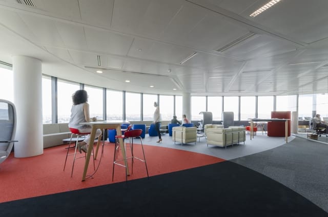Bright, modern meeting room with modular lounge seating for collaborative business events.
