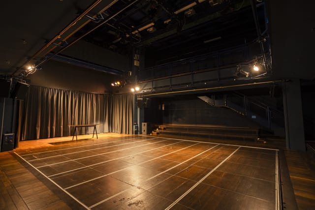 Black box studio at Gasteig with overhead grid for intimate concerts and workshop events.