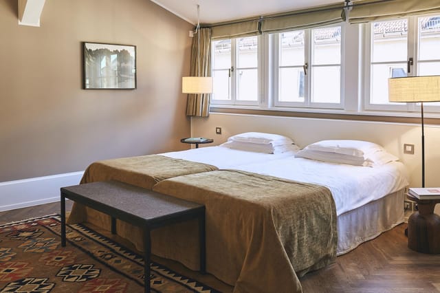 Twin-share hotel suite at Cortiina Hotel for corporate travel and conference accommodation.