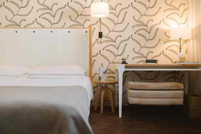 Cortiina Hotel suite with workspace for business travel and conference stays.