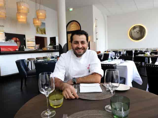 Polished Pageou restaurant space with head chef for corporate dinners and networking events.