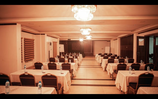 Schoolroom-style meeting setup in Empresa Hotel executive boardroom for corporate training event.