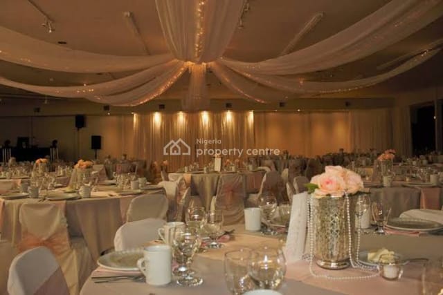 Banquet hall in The Condo with draped ceilings, ideal for elegant wedding and gala events.
