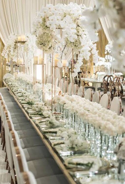 Luxury event hall tablescape with minimalist floral decor for upscale gala or wedding reception.