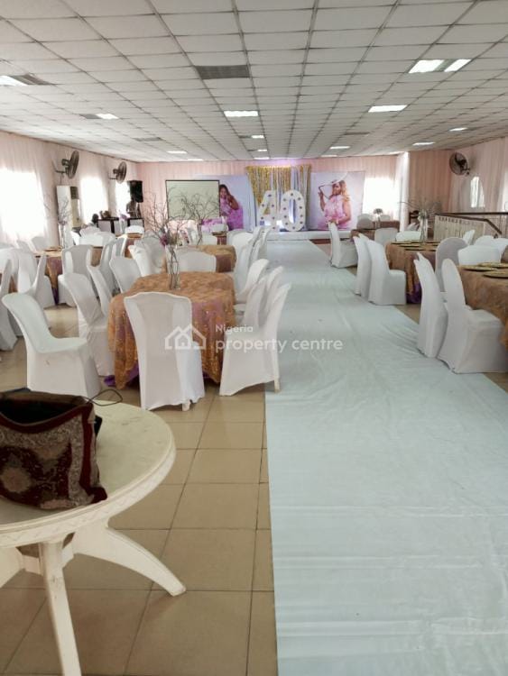 Banquet event hall with gold overlays for 40th birthday party celebration.