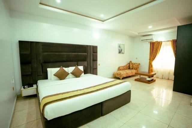 Upscale luxury hotel guest room for business travel and VIP conference stays.
