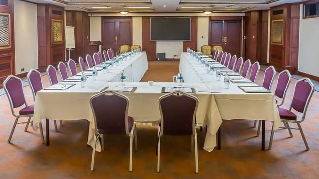 U-shape boardroom at Serena Hotel & Suites, ideal for corporate meetings and team conferences.