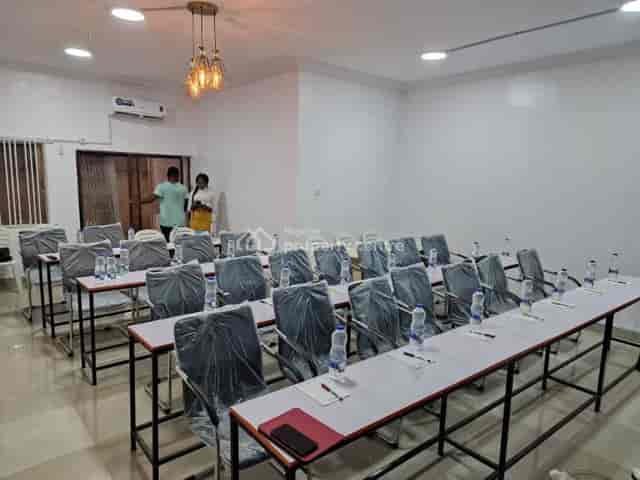 Classroom-style workshop space with plastic-covered seating for corporate event venue rental.