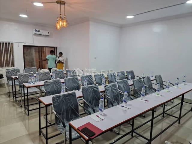 Classroom-style workshop space with plastic-covered seating for corporate event venue rental.