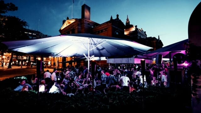 Networking event at Lawo Terrasse with outdoor structural covering. Corporate evening mixer.