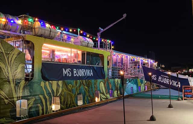 Upper Deck event space on MS Bjørvika, illuminated boat venue for evening receptions and parties.