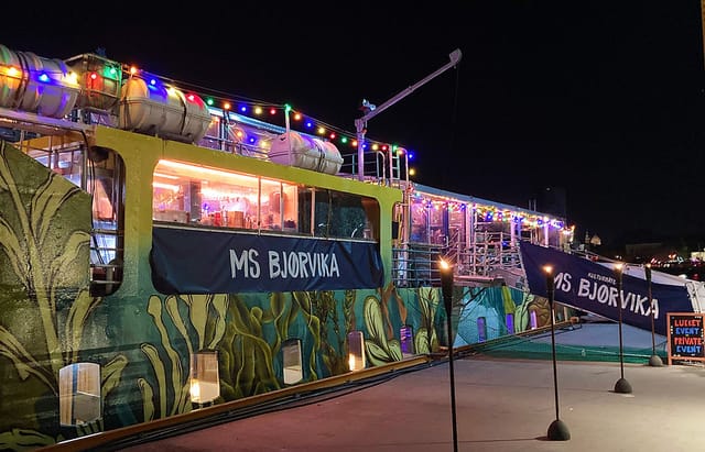 Upper Deck event space on MS Bjørvika, illuminated boat venue for evening receptions and parties.