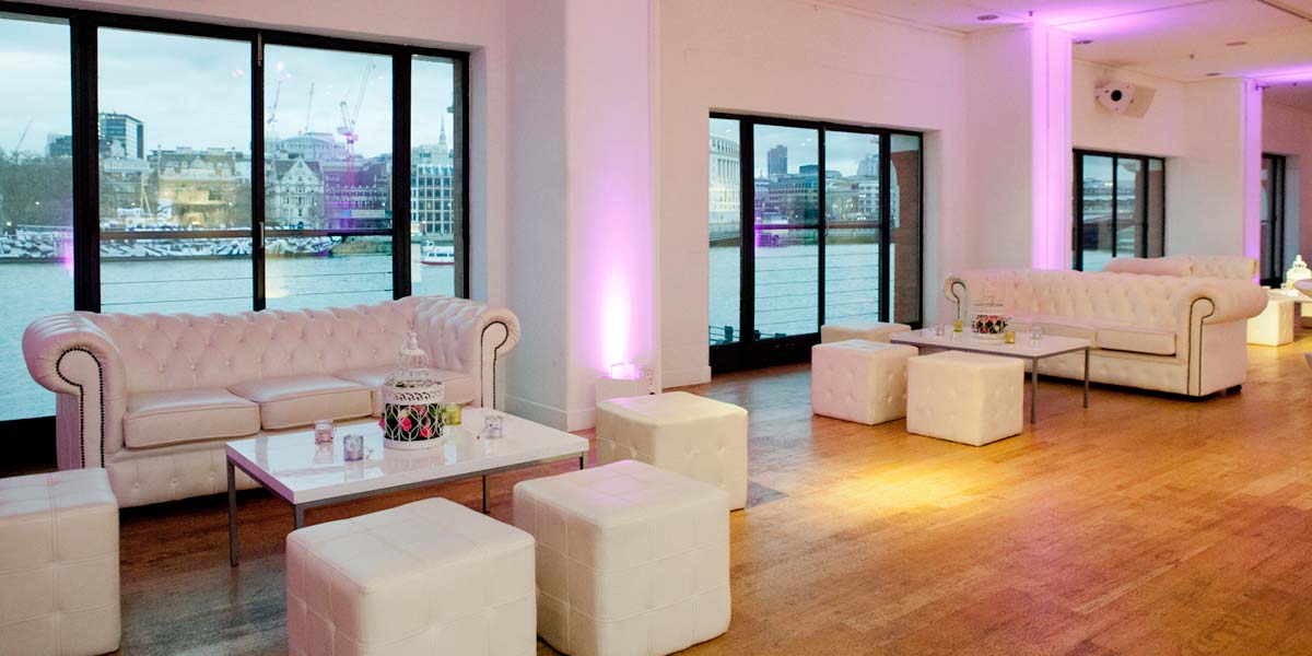 Elegant event space in OXO2 with waterfront views and purple lighting for networking events. - Banner