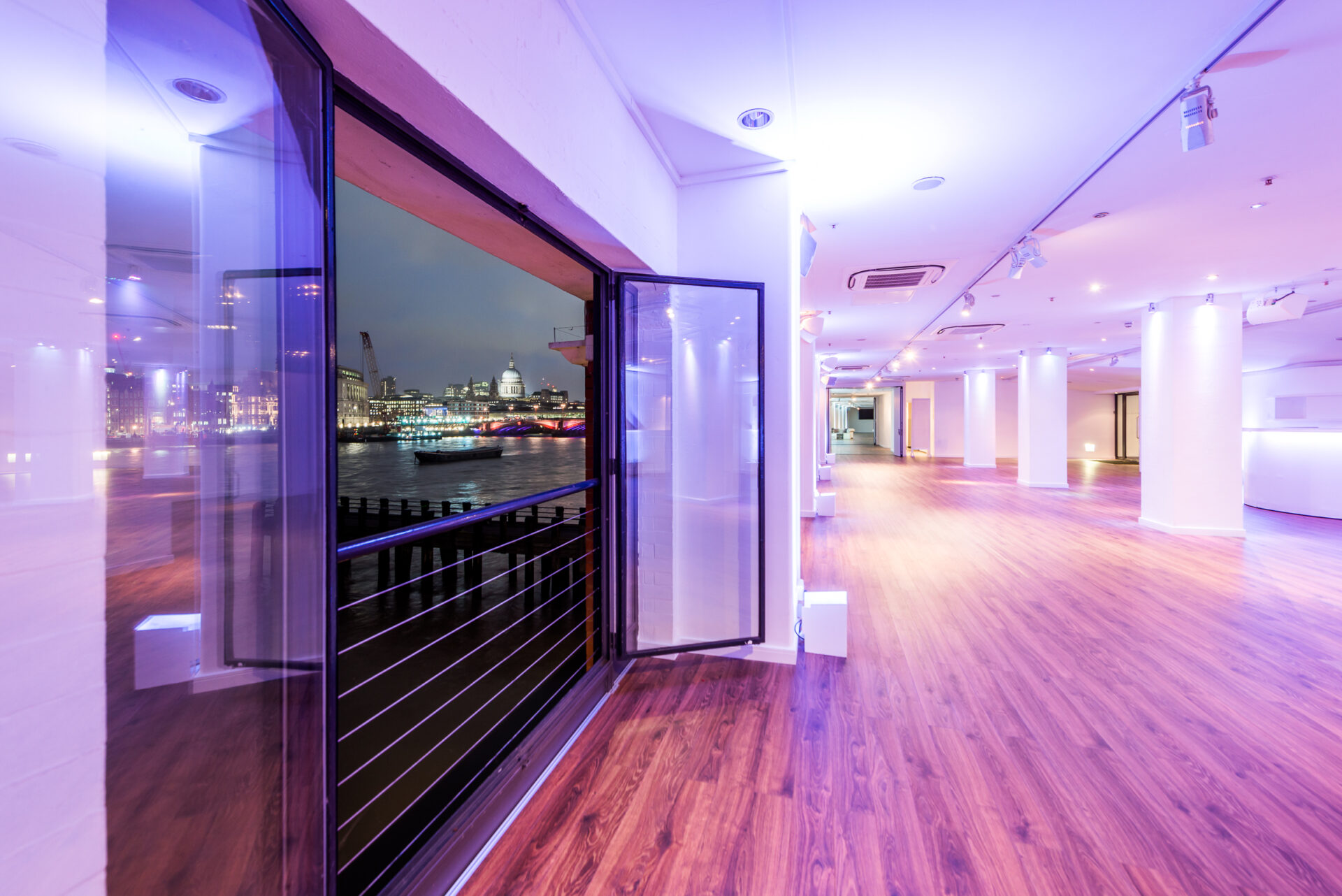 Sleek OXO2 event space with expansive windows for corporate and social gatherings. - Banner