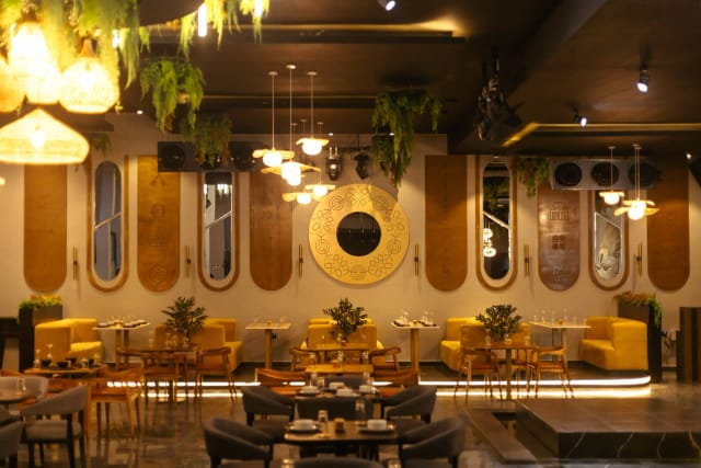 Stylish Trib3 Lagos restaurant interior with booth seating for corporate dinners and networking.
