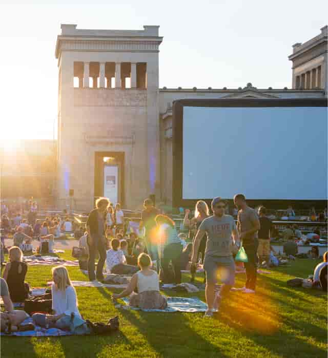 Kino Open Air screening at SPACE: outdoor movie event, community film festival, golden hour.