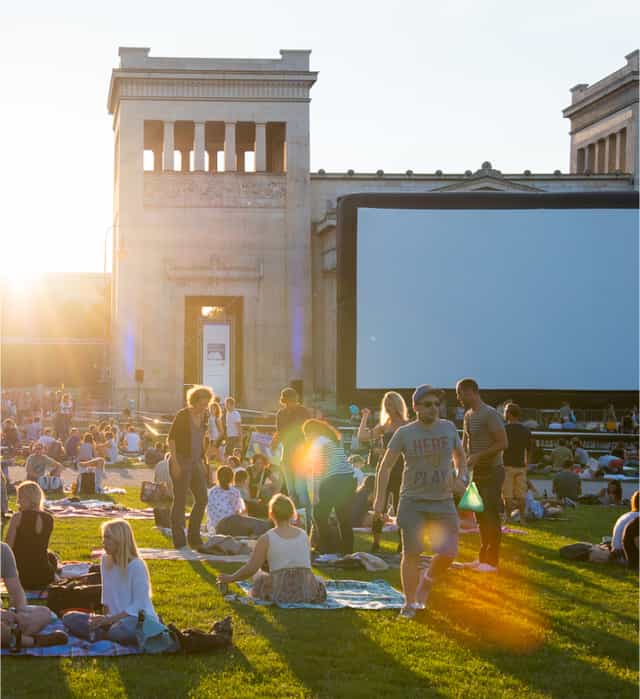 Kino Open Air screening at SPACE: outdoor movie event, community film festival, golden hour.