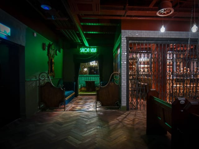 Moody Salon Verte speakeasy lounge at Project Halcyon Distillery for VIP events and receptions.
