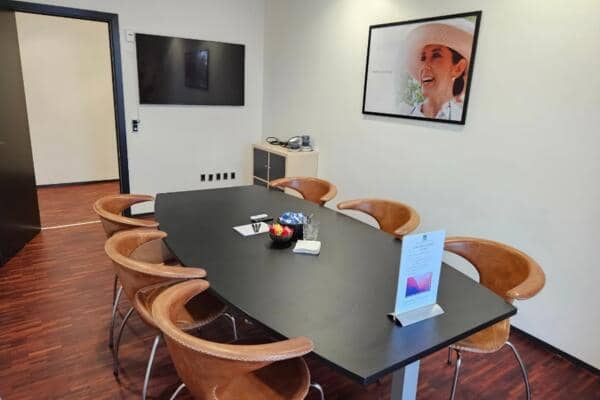 Royal Conference boardroom with AV setup for small-group business meetings and corporate events.